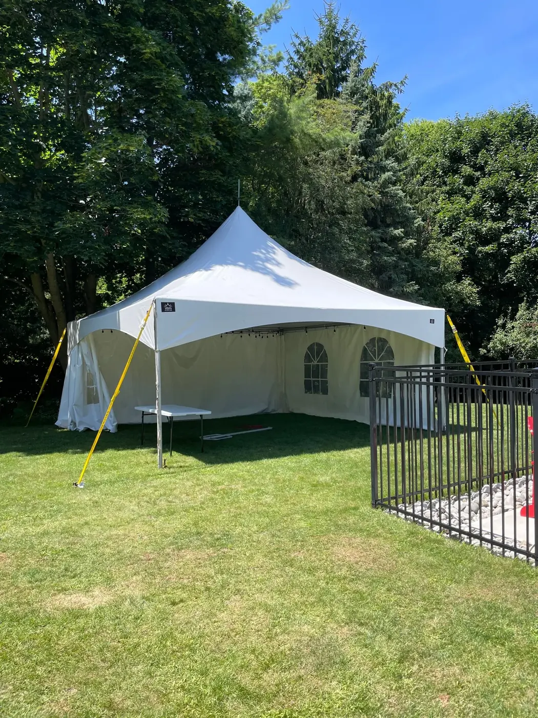 A white tent on a Brampton lawn for a backyard birthday party